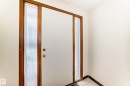 Doorway with baseboards and tile patterned floors - 12028 87 Street, Edmonton, AB  - Indoor Photo Showing Other Room 