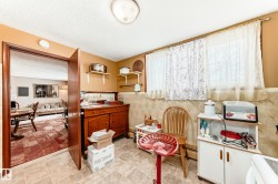 Office space with wainscoting and a textured ceiling - 