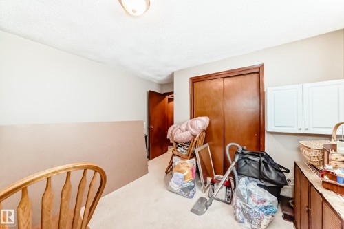 Bedroom with light colored carpet and a closet - 12028 87 Street, Edmonton, AB - Indoor