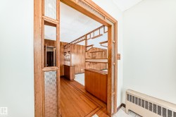 Hallway featuring radiator heating unit - 