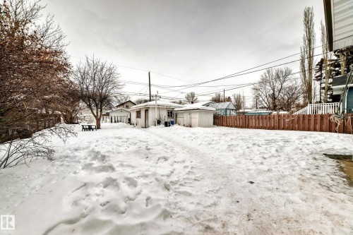 Yard layered in snow with a storage unit - 12028 87 Street, Edmonton, AB - Outdoor