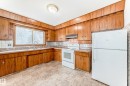 Kitchen featuring white appliances, light countertops, open shelves, and under cabinet range hood - 12028 87 Street, Edmonton, AB  - Indoor Photo Showing Kitchen 