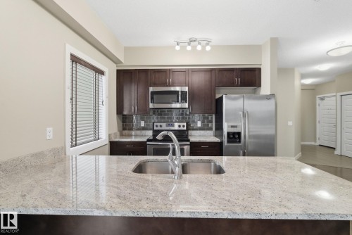 214 1238 Windermere Way, Edmonton, AB - Indoor Photo Showing Kitchen With Stainless Steel Kitchen With Double Sink With Upgraded Kitchen