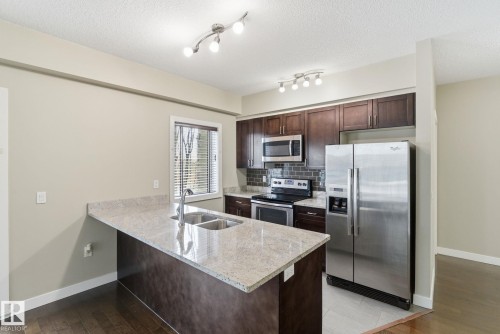 214 1238 Windermere Way, Edmonton, AB - Indoor Photo Showing Kitchen With Stainless Steel Kitchen With Double Sink