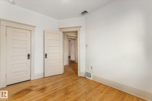 Unfurnished bedroom with a closet and light wood-type flooring - 10921 126 Street, Edmonton, AB - Indoor Photo Showing Other Room