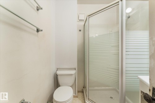 Bathroom featuring toilet and a shower stall - 10921 126 Street, Edmonton, AB - Indoor Photo Showing Bathroom