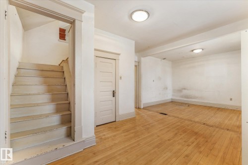 Staircase featuring hardwood / wood-style flooring - 10921 126 Street, Edmonton, AB - Indoor Photo Showing Other Room