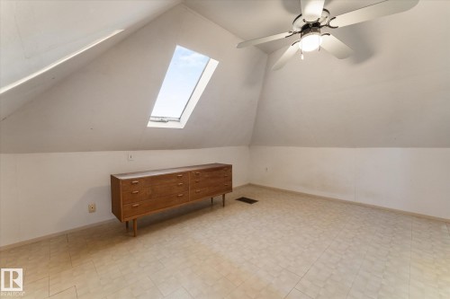 Bonus room with a skylight, a ceiling fan, vaulted ceiling, and light floors - 10921 126 Street, Edmonton, AB - Indoor Photo Showing Other Room