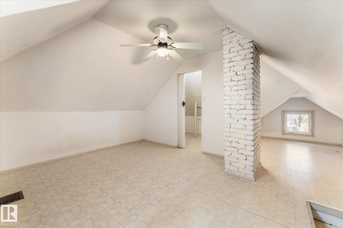 Additional living space featuring lofted ceiling, a ceiling fan, and light flooring - 10921 126 Street, Edmonton, AB - Indoor Photo Showing Other Room