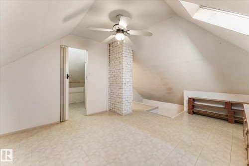 Bonus room with vaulted ceiling, a skylight, light flooring, and a ceiling fan - 10921 126 Street, Edmonton, AB - Indoor Photo Showing Other Room