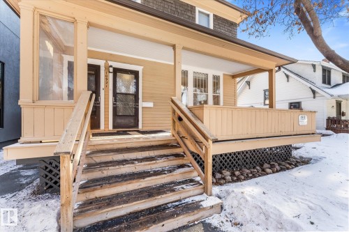 Snow covered property entrance with covered porch - 10921 126 Street, Edmonton, AB - Outdoor With Deck Patio Veranda