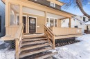 Snow covered property entrance with covered porch - 10921 126 Street, Edmonton, AB  - Outdoor With Deck Patio Veranda 