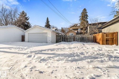 View of yard featuring a detached garage and an outbuilding - 10921 126 Street, Edmonton, AB - Outdoor