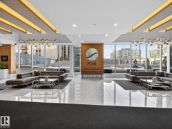 Lobby with a city view and a wall of windows - 