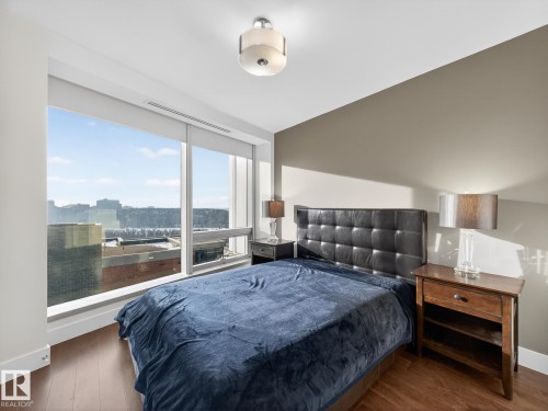 Bedroom with wood finished floors - 902 11969 Jasper Avenue, Edmonton, AB - Indoor Photo Showing Bedroom