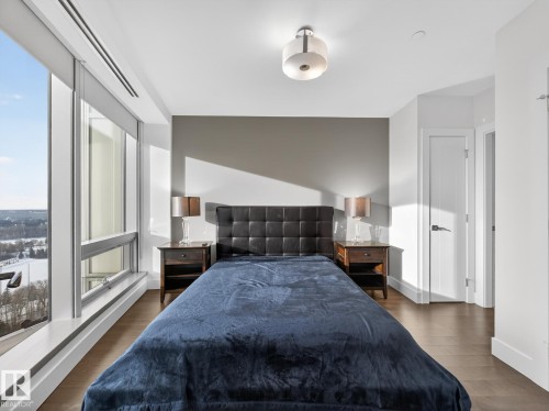 Bedroom featuring dark wood-style floors and baseboards - 902 11969 Jasper Avenue, Edmonton, AB - Indoor Photo Showing Bedroom