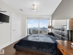 Bedroom featuring wood finished floors and access to exterior - 