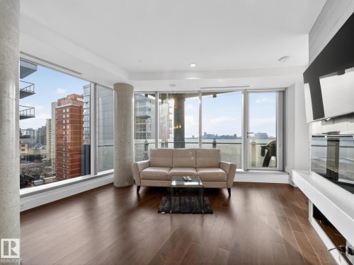 Living room with dark wood finished floors - 902 11969 Jasper Avenue, Edmonton, AB - Indoor Photo Showing Living Room