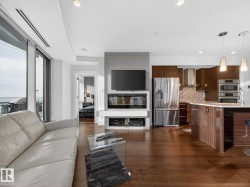 Living room featuring dark wood finished floors - 
