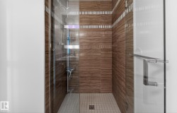Bathroom featuring a stall shower - 