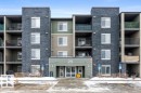 Snow covered building featuring a view of apartment building / complex - 107 25 Element Dr, St. Albert, AB  - Outdoor With Facade 
