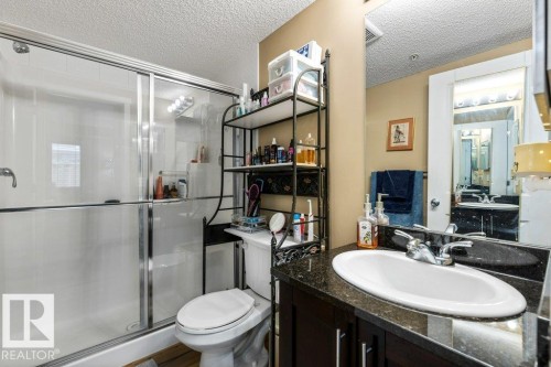 Full bath featuring a textured ceiling, vanity, and a shower stall - 107 25 Element Dr, St. Albert, AB - Indoor Photo Showing Bathroom