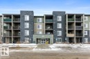 Snow covered building with a view of apartment building / complex and uncovered parking - 107 25 Element Dr, St. Albert, AB  - Outdoor With Facade 