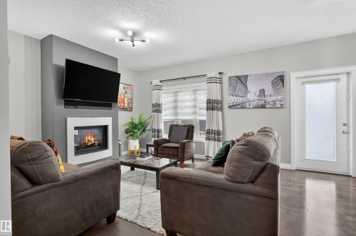 618 Adams Way Sw, Edmonton, AB - Indoor Photo Showing Living Room With Fireplace