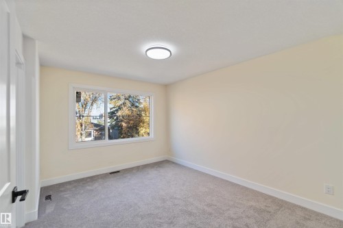 13'5"x10'10" with ensuite and walk in closet! - 8319 81Ave, Edmonton, AB - Indoor Photo Showing Other Room