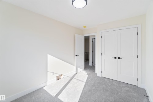 Legal suite bedroom 2 9'7" x 8'8" - 8319 81Ave, Edmonton, AB - Indoor Photo Showing Other Room