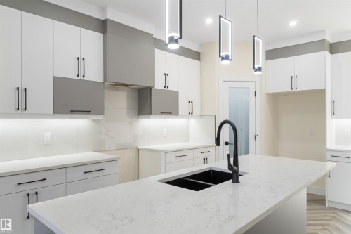 Undermount silgranite sink as an extra! - 8319 81Ave, Edmonton, AB - Indoor Photo Showing Kitchen With Double Sink With Upgraded Kitchen