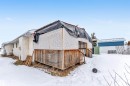 Snow covered property featuring a wooden deck and stucco siding - 6741 162A Avenue, Edmonton, AB  - Outdoor 