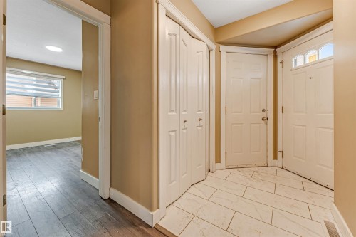 Foyer entrance with plenty of natural light and light marble finish floors - 6741 162A Avenue, Edmonton, AB - Indoor Photo Showing Other Room