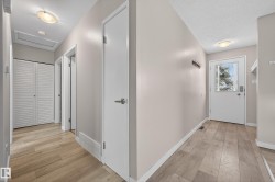 Hall with light wood-type flooring and attic access - 