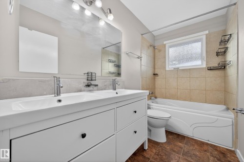Bathroom with double vanity and  shower combination - 8328 164 Street, Edmonton, AB - Indoor Photo Showing Bathroom
