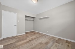 Unfurnished bedroom with a closet and light wood-type flooring - 