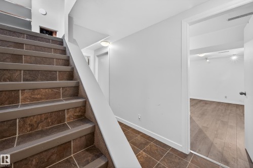 Staircase featuring baseboards - 8328 164 Street, Edmonton, AB - Indoor Photo Showing Other Room