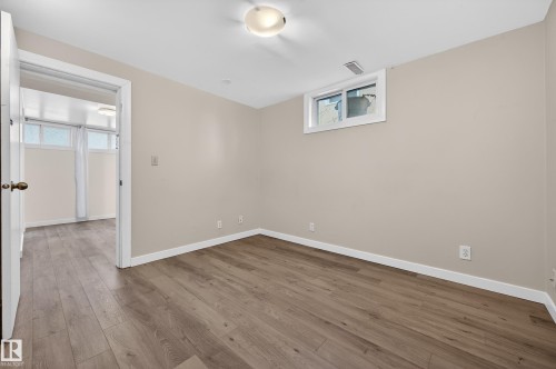 Empty room with hardwood / wood-style floors - 8328 164 Street, Edmonton, AB - Indoor Photo Showing Other Room