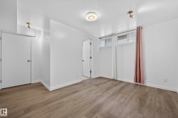 Unfurnished bedroom featuring light wood finished floors and baseboards - 