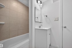 Bathroom with vanity and shower / tub combination - 