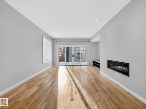 9803 74 Avenue, Edmonton, AB - Indoor Photo Showing Living Room With Fireplace