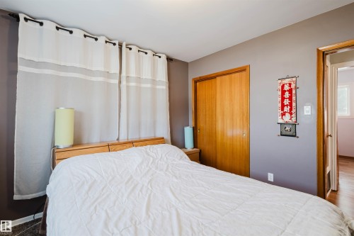 Bedroom featuring a closet and baseboards - 13315 134 Avenue, Edmonton, AB - Indoor Photo Showing Bedroom