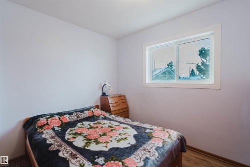 Bedroom with dark wood finished floors - 13315 134 Avenue, Edmonton, AB - Indoor Photo Showing Bedroom