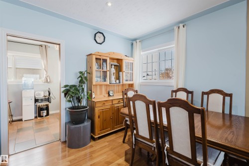 Dining area with light wood-style flooring - 13315 134 Avenue, Edmonton, AB - Indoor Photo Showing Dining Room