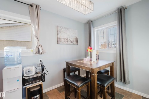 Dining area featuring baseboards and wood finished floors - 13315 134 Avenue, Edmonton, AB - Indoor Photo Showing Dining Room