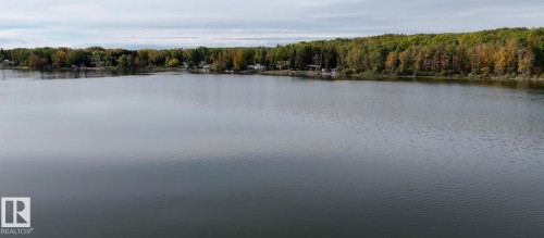 Water view with a forest - 34 Ella Mae Crescent, Athabasca Town, AB - Outdoor With Body Of Water With View