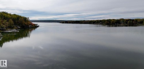 Water view with a forest - 34 Ella Mae Crescent, Athabasca Town, AB - Outdoor With Body Of Water With View