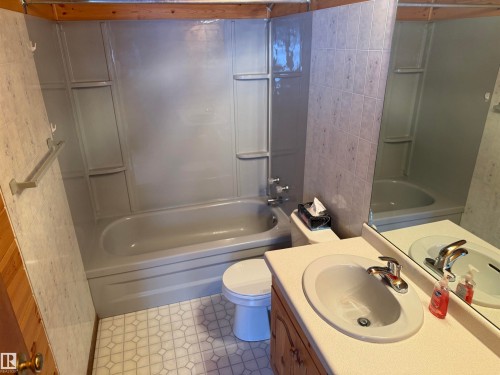 Bathroom with shower / tub combination, vanity, and tile patterned flooring - 34 Ella Mae Crescent, Athabasca Town, AB - Indoor Photo Showing Bathroom