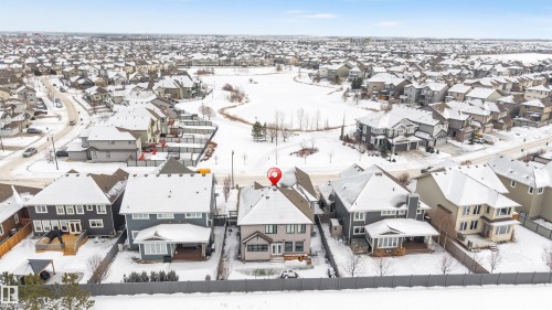 Snowy aerial view featuring a residential view - 656 180 Street, Edmonton, AB - Outdoor With View