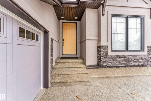 Entrance to property with stone siding and stucco siding - 656 180 Street, Edmonton, AB - Outdoor With Exterior